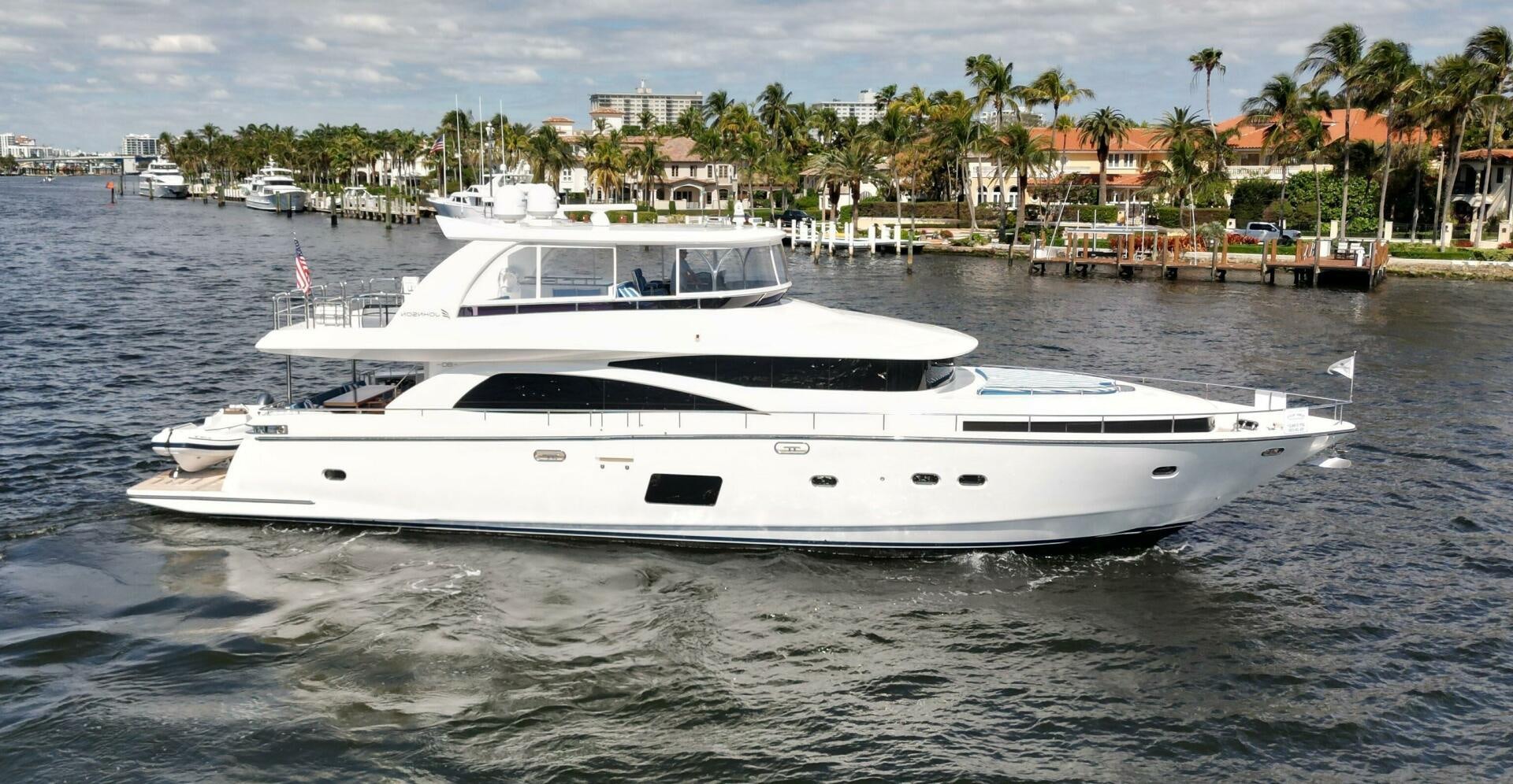 a white yacht in the water aboard DEESCOVERY Yacht for Sale