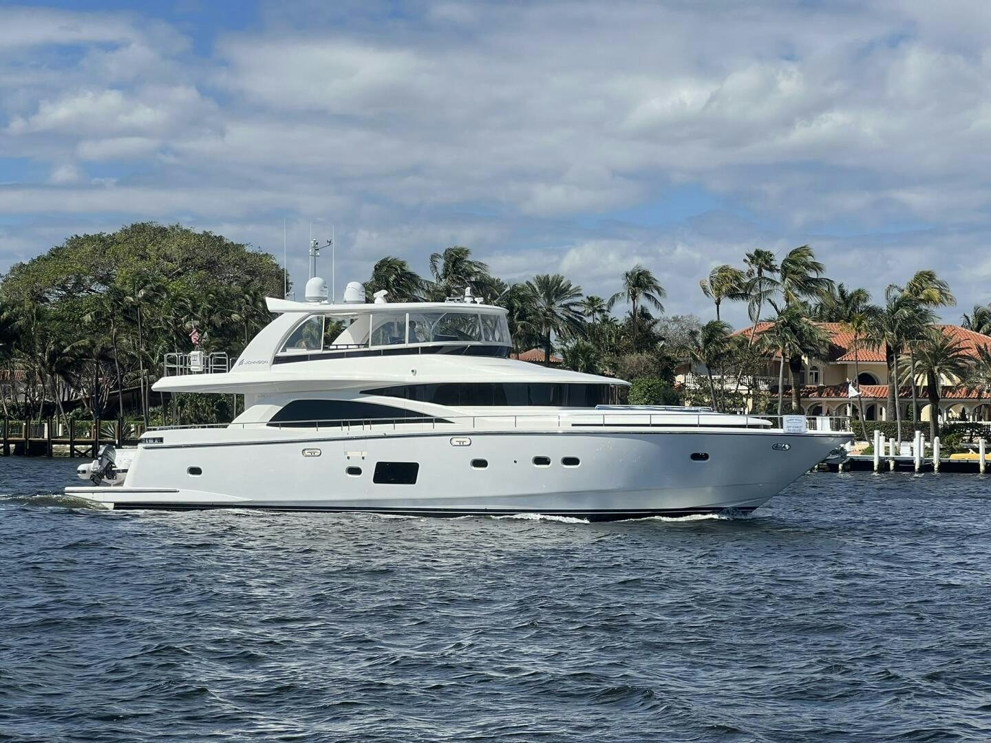 a white yacht in the water aboard DEESCOVERY Yacht for Sale