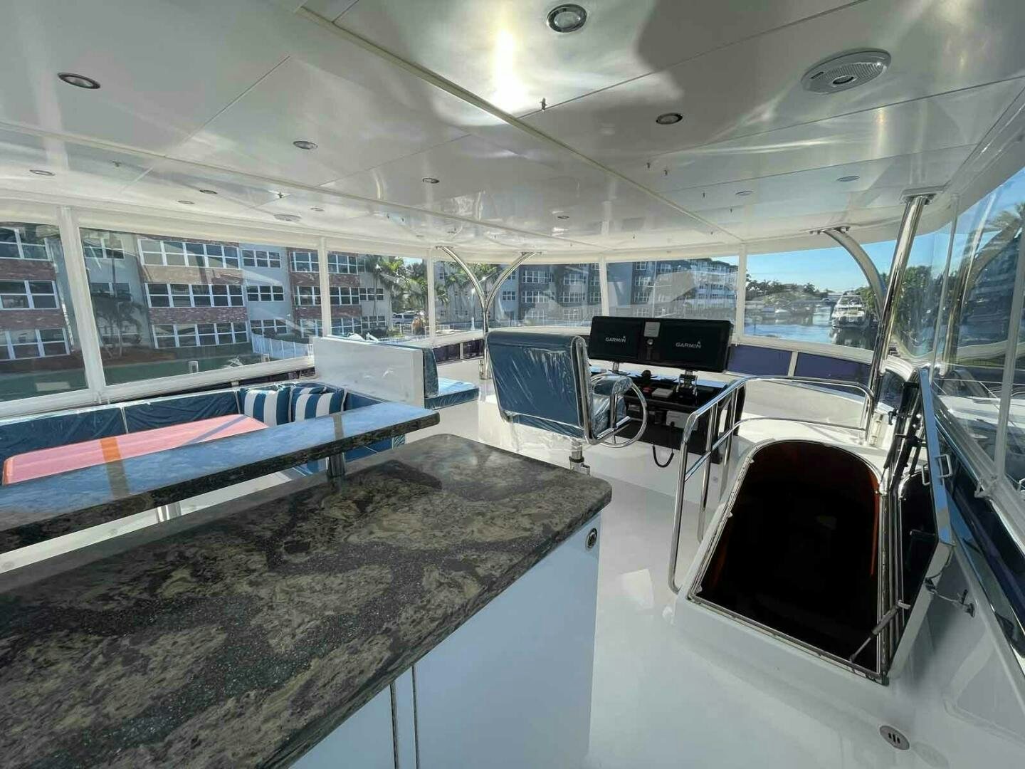 inside of a building with a pool table and chairs aboard DEESCOVERY Yacht for Sale
