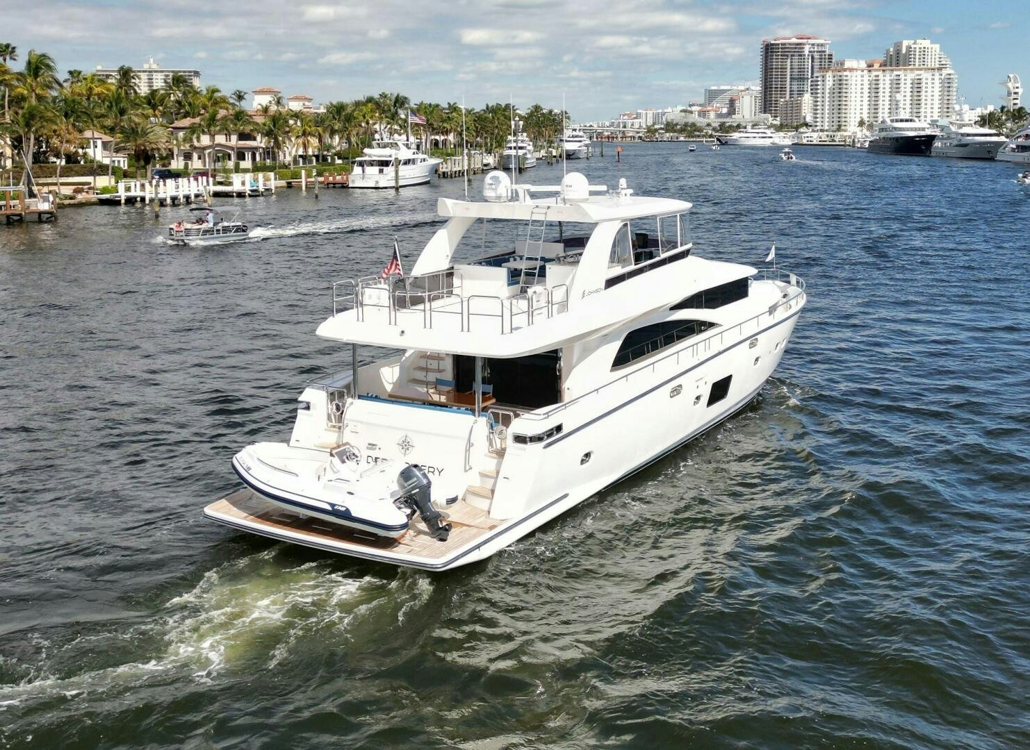 a white boat in the water aboard DEESCOVERY Yacht for Sale