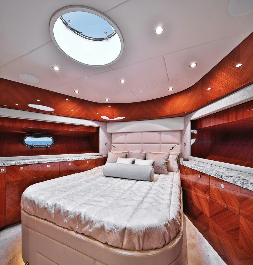 a room with a bed and a window aboard DEESCOVERY Yacht for Sale