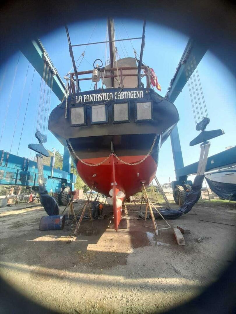 a large boat on a dock aboard LA FANTASTICA Yacht for Sale