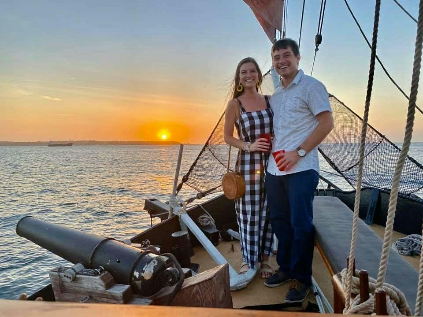 a man and woman on a boat aboard LA FANTASTICA Yacht for Sale