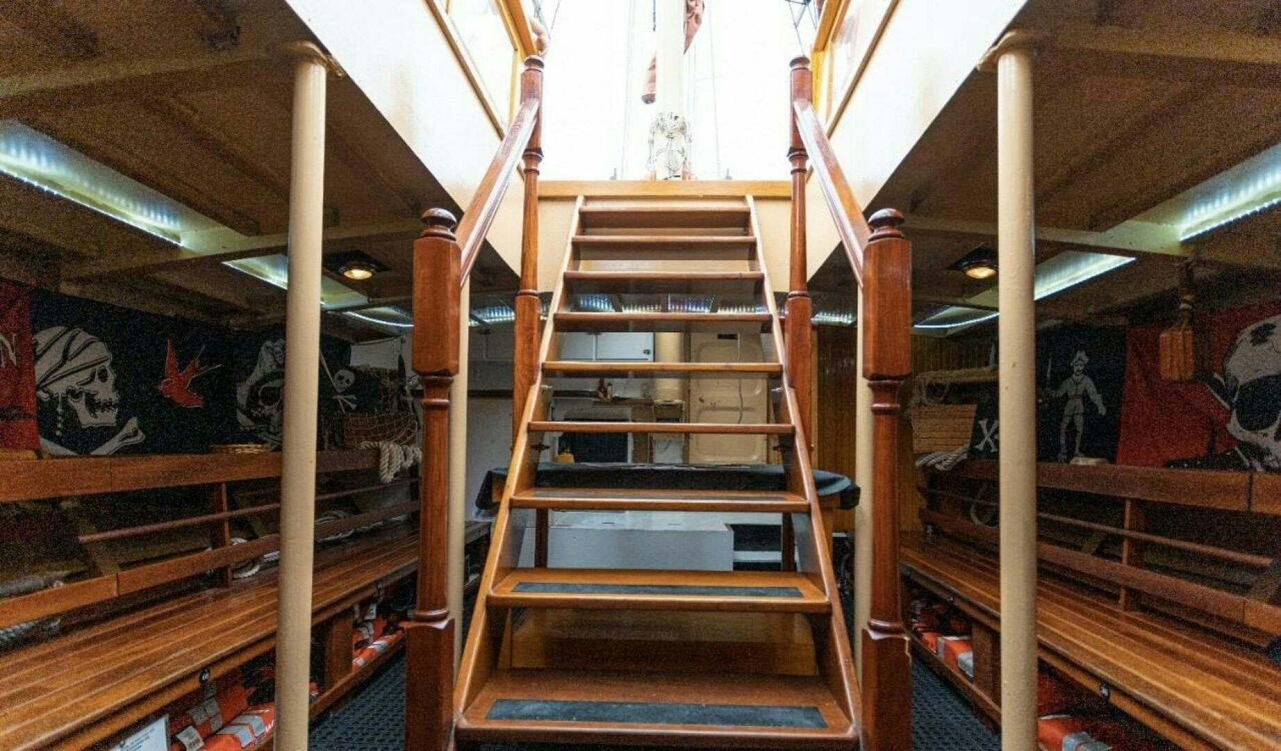 a wooden staircase in a building aboard LA FANTASTICA Yacht for Sale