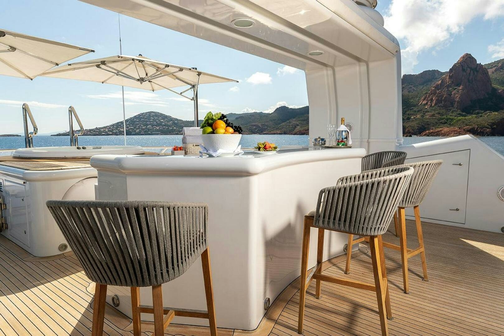 a table and chairs on a deck aboard FRIENDSHIP Yacht for Sale