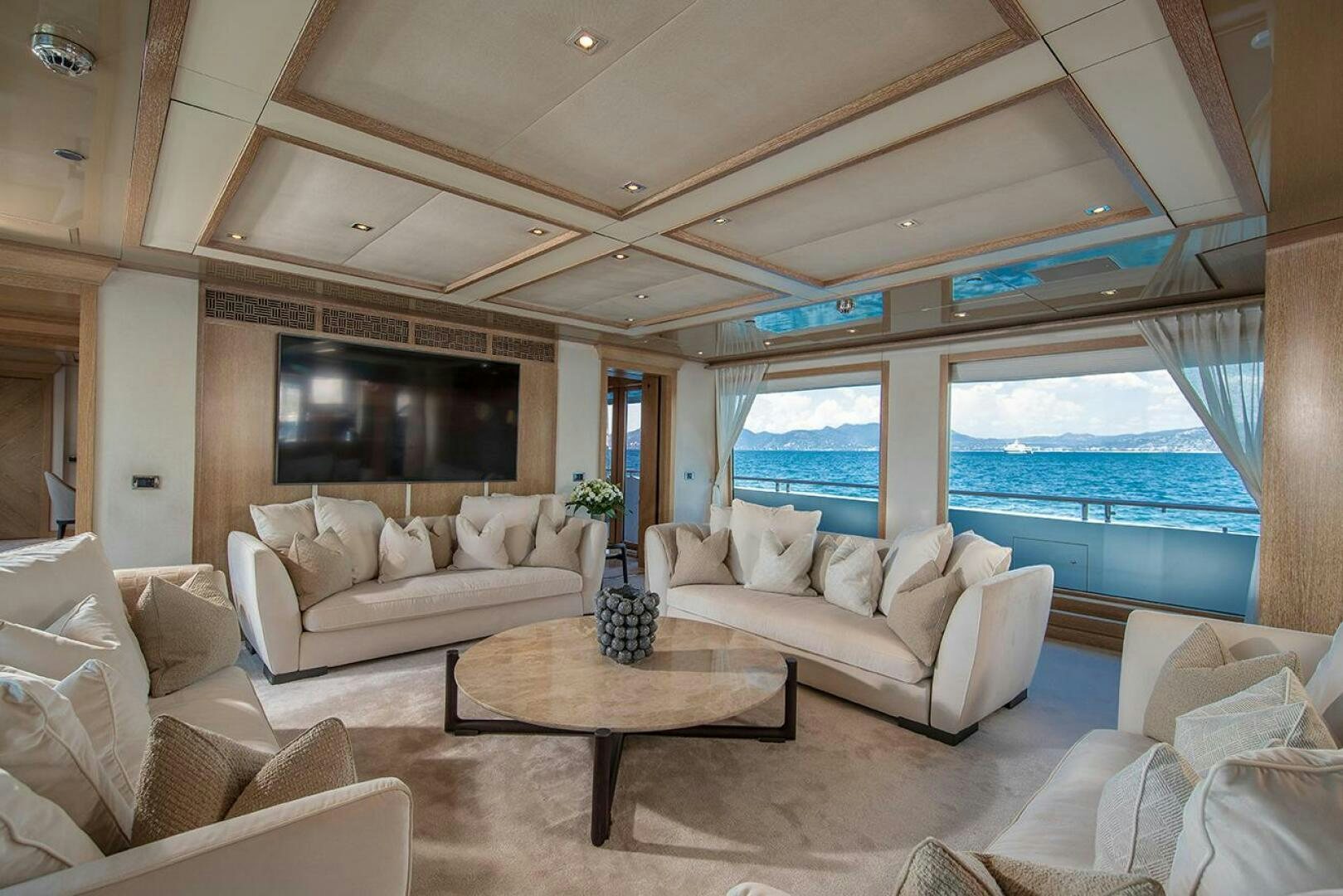 a living room with a large window aboard FRIENDSHIP Yacht for Sale