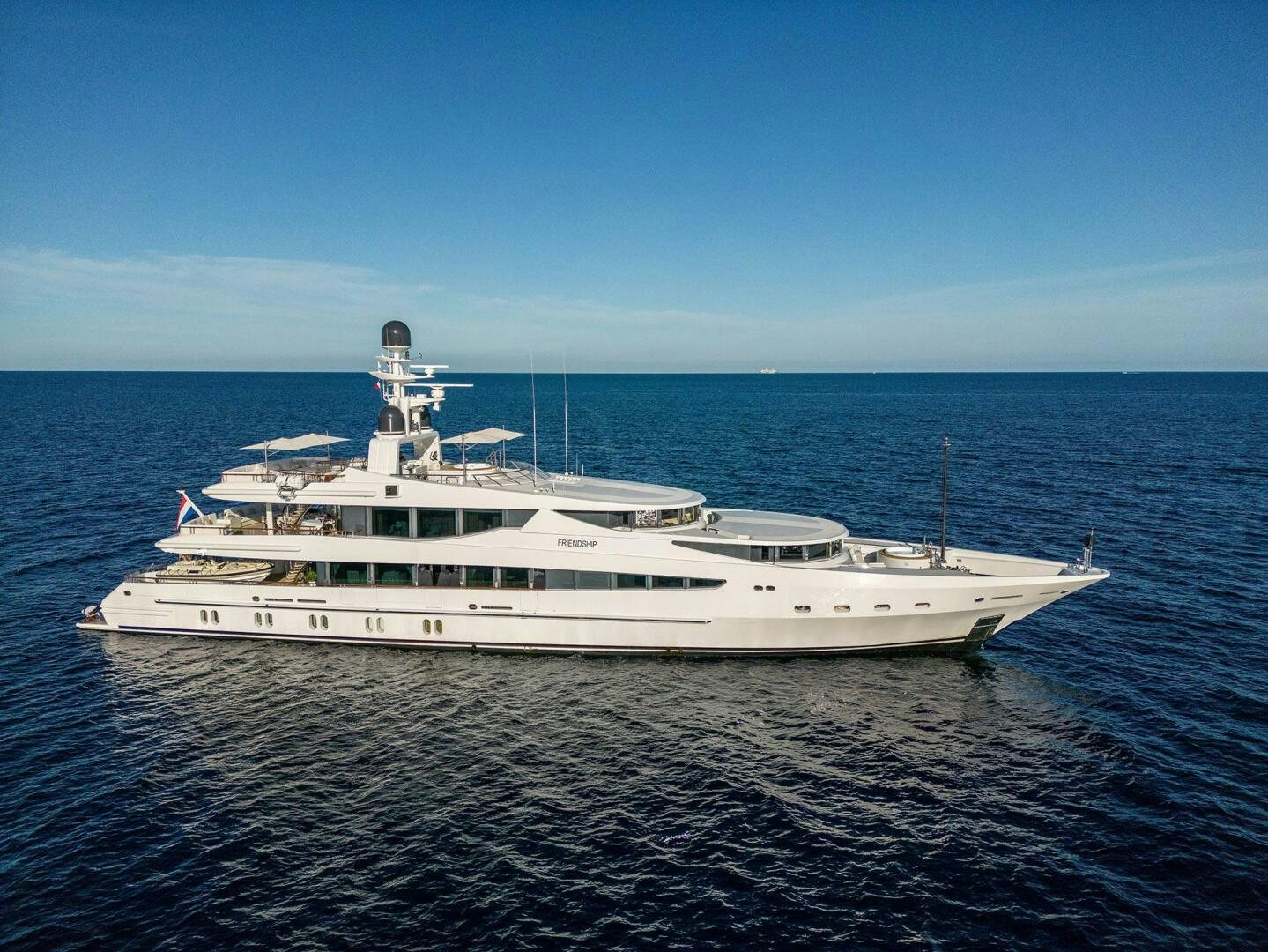 a white yacht in the water aboard FRIENDSHIP Yacht for Sale