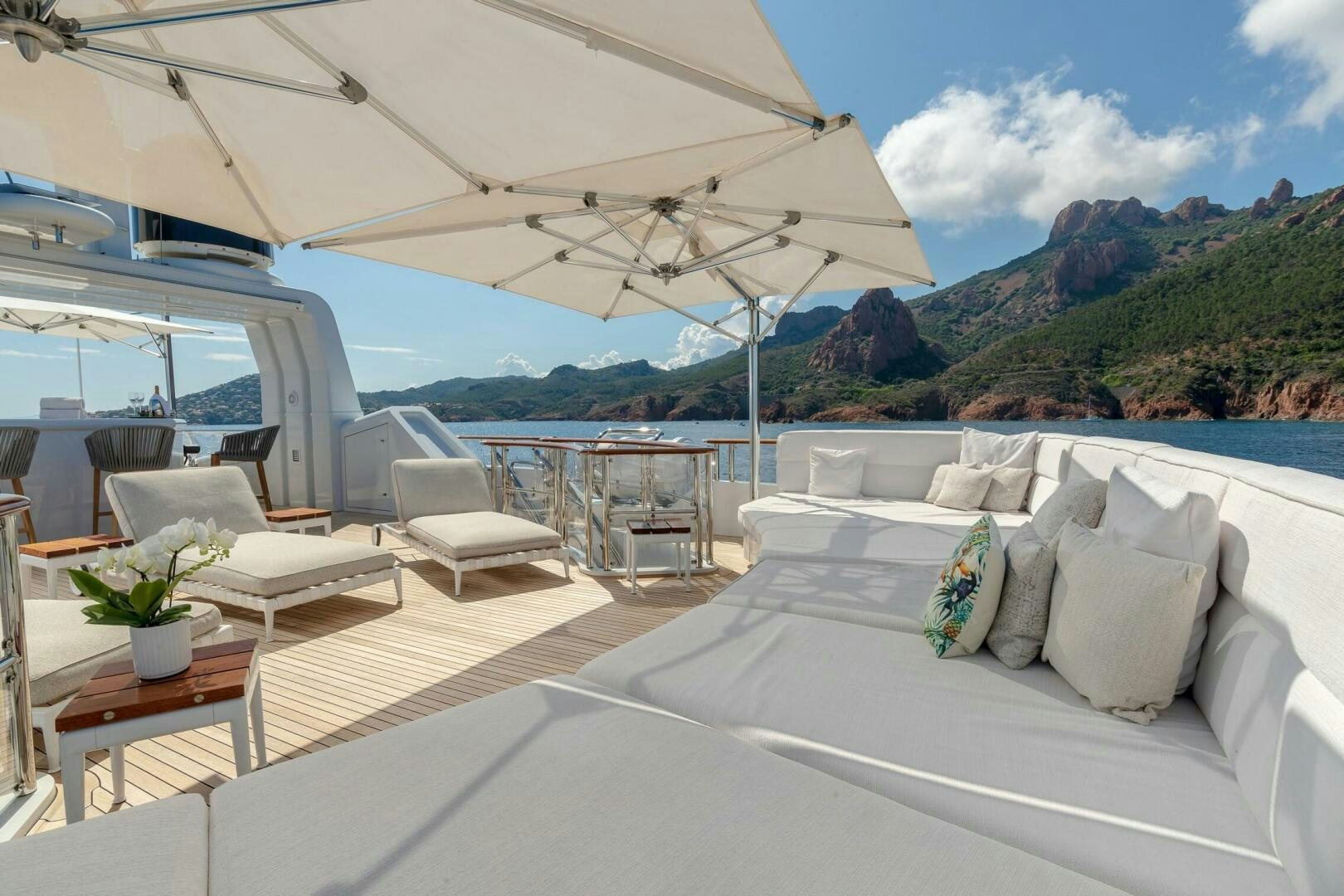 a room with a bed and a table and chairs aboard FRIENDSHIP Yacht for Sale