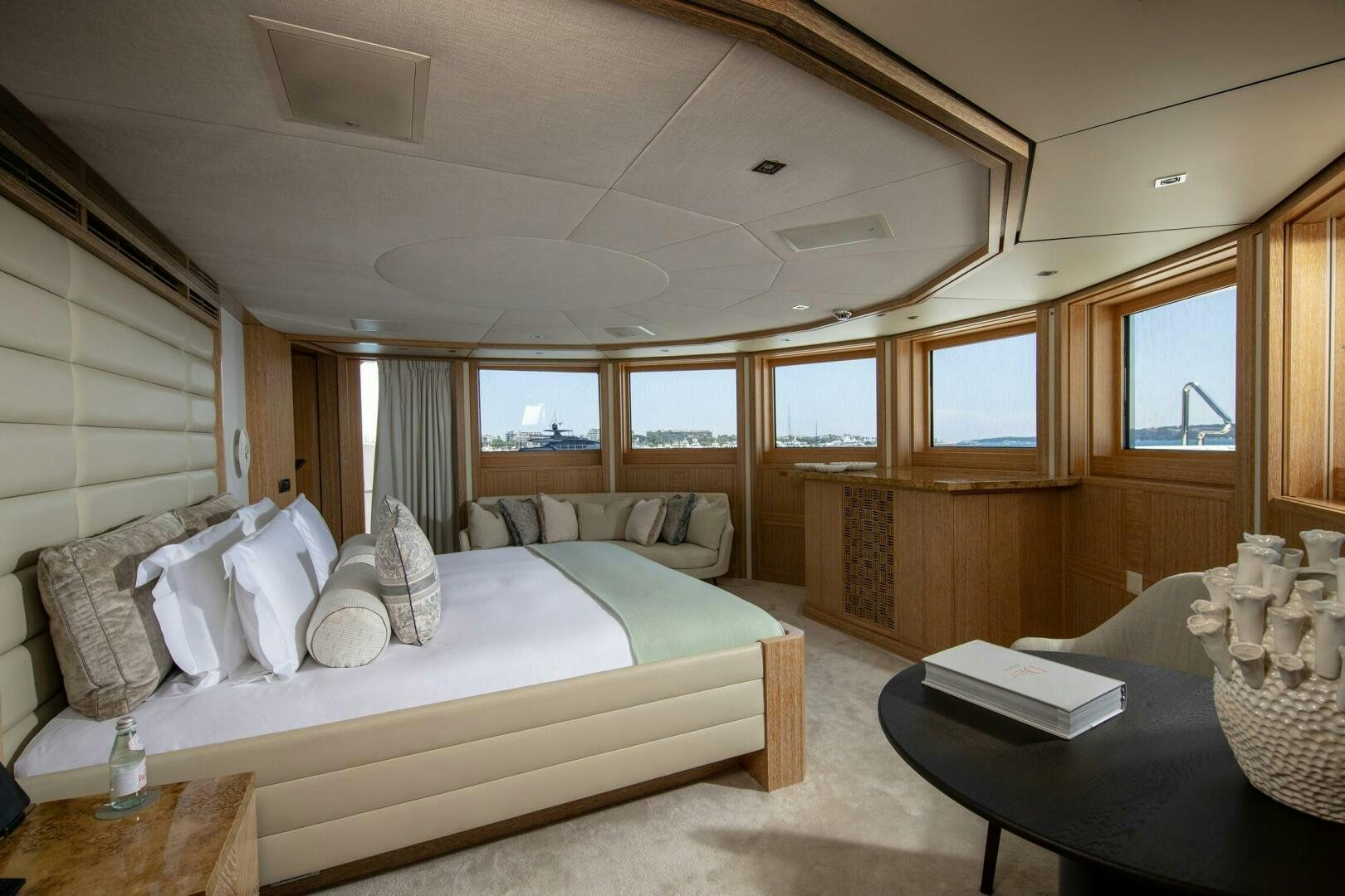 a room with a bed and a table aboard FRIENDSHIP Yacht for Sale