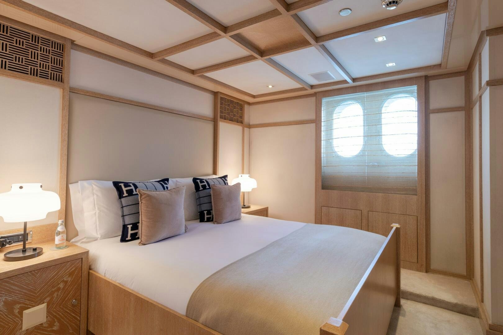 a bed with a white bed spread aboard FRIENDSHIP Yacht for Sale