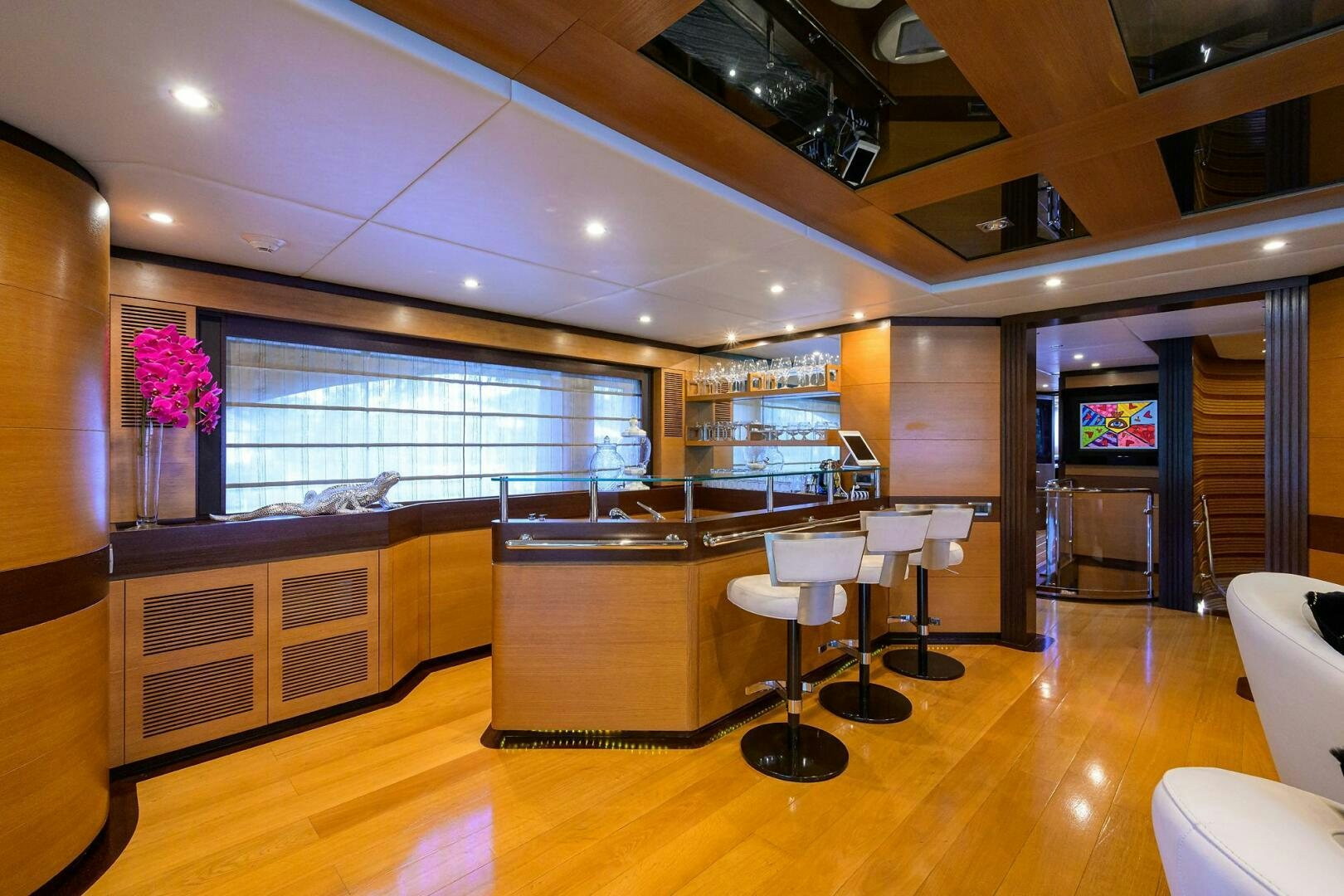 a kitchen with a bar and a table aboard KIMBERLIE Yacht for Sale