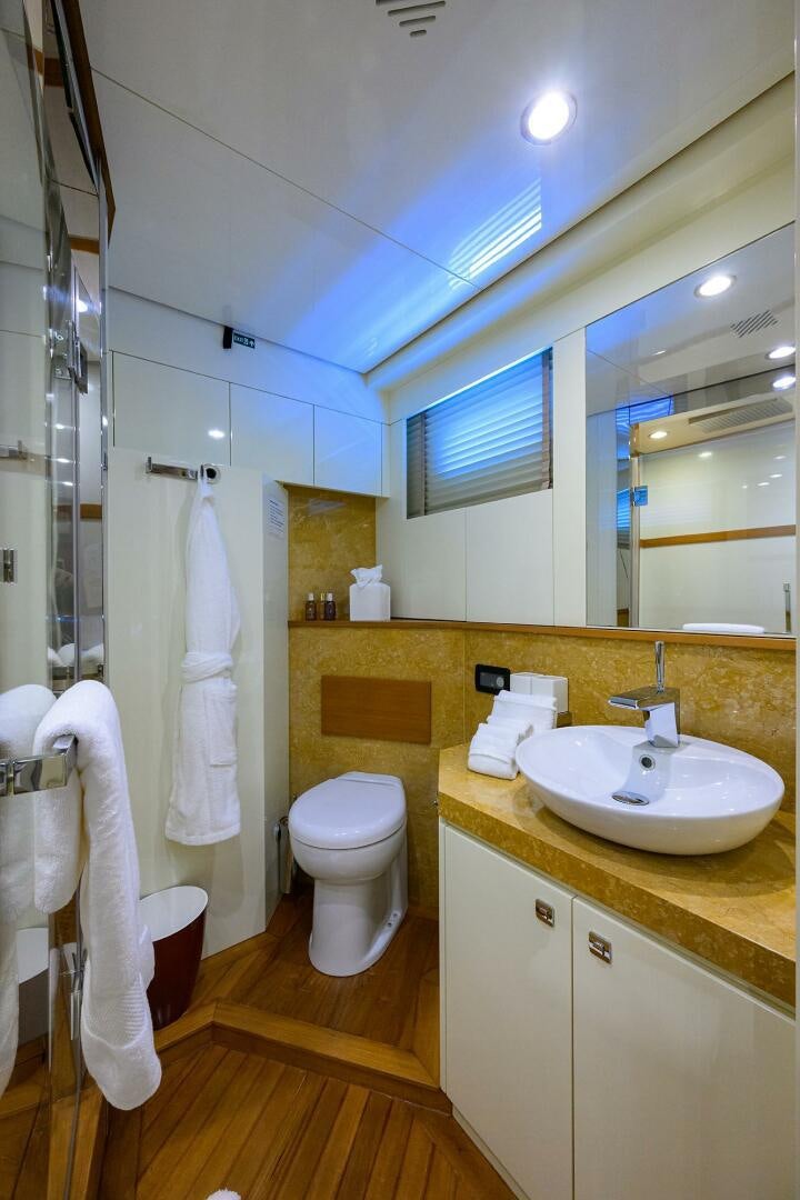 a bathroom with a toilet and sink aboard KIMBERLIE Yacht for Sale