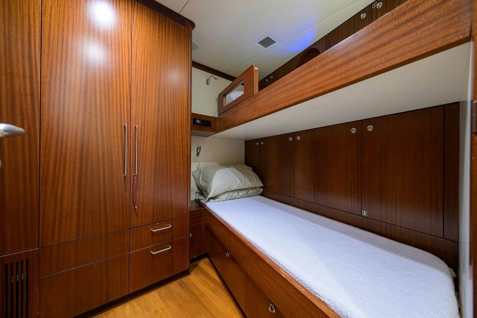 a room with a bed and a closet aboard KIMBERLIE Yacht for Sale