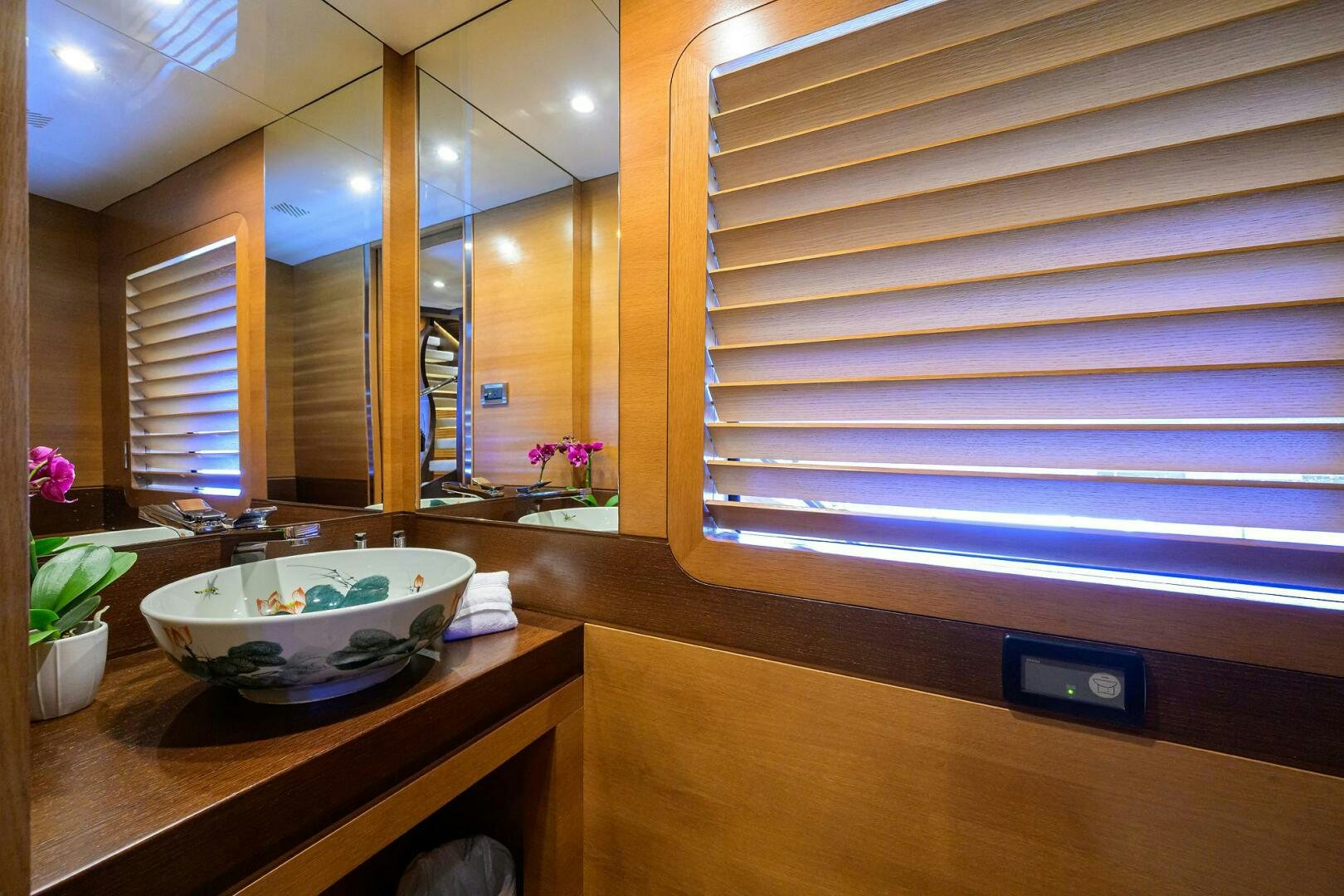 a bathroom with a sink and a mirror aboard KIMBERLIE Yacht for Sale