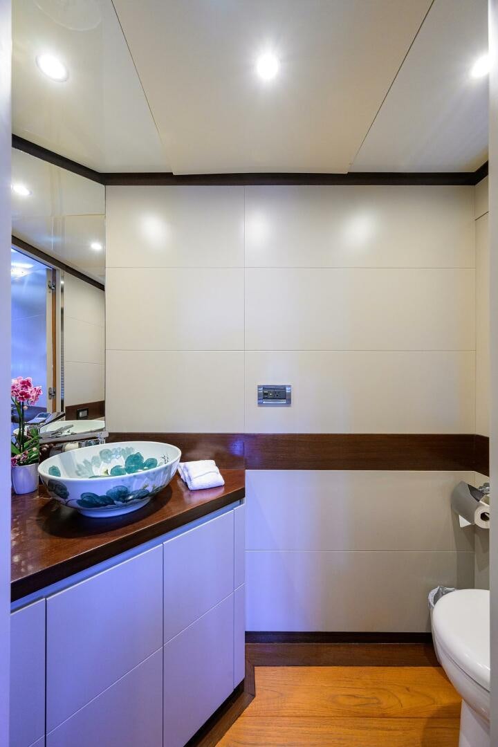 a bathroom with a sink and a mirror aboard KIMBERLIE Yacht for Sale