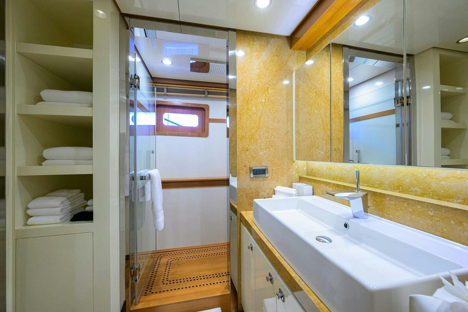 a bathroom with a sink and a mirror aboard KIMBERLIE Yacht for Sale