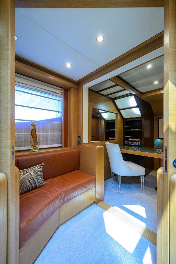 a living room with a couch and a table aboard KIMBERLIE Yacht for Sale