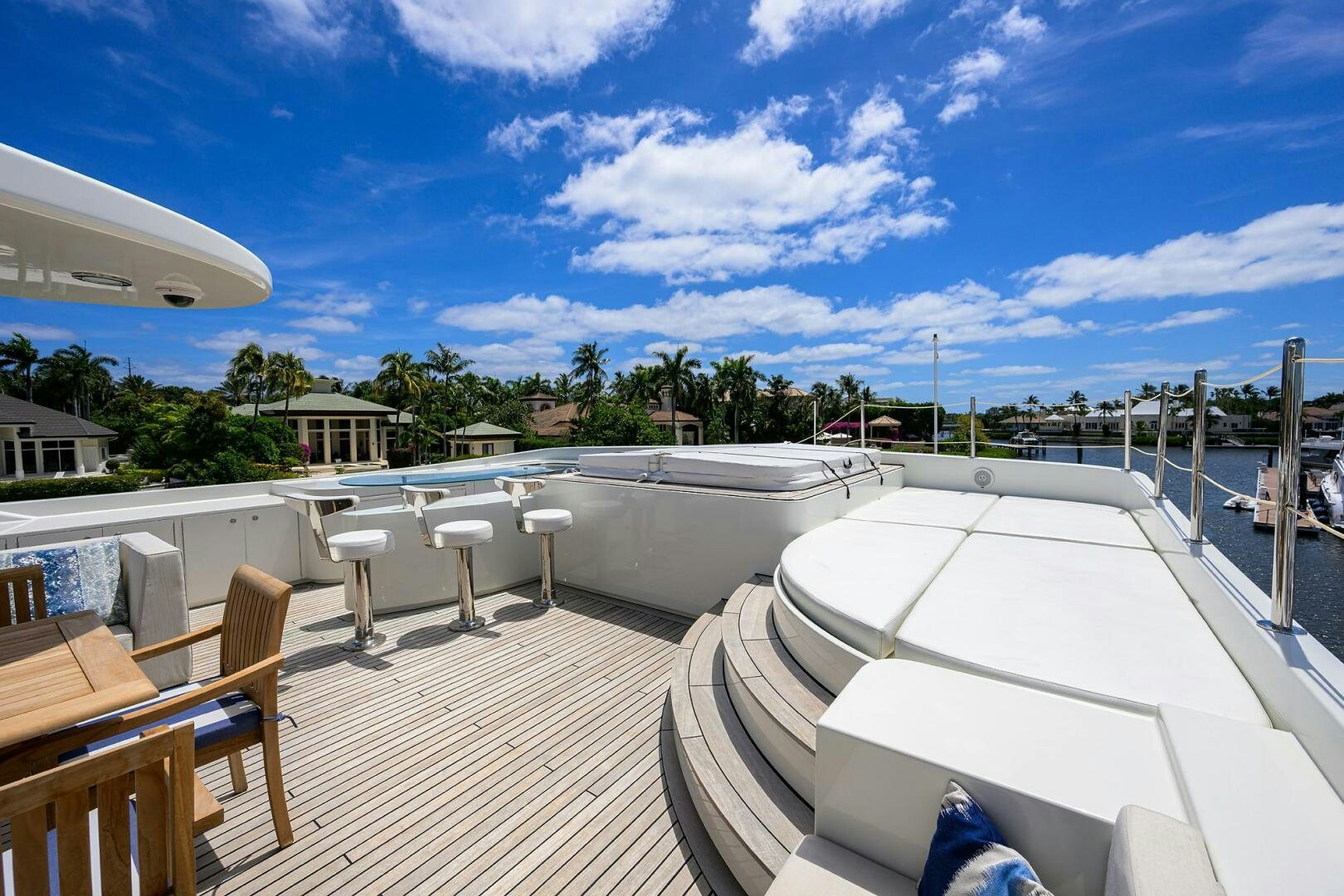 a deck with chairs and tables on it aboard KIMBERLIE Yacht for Sale