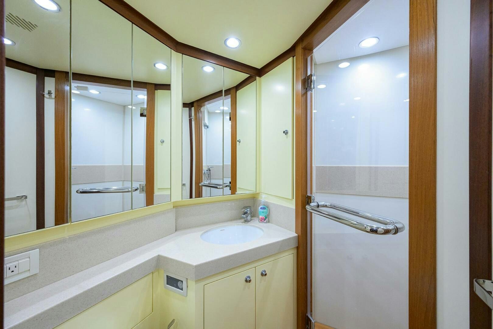 a bathroom with a large mirror aboard KIMBERLIE Yacht for Sale
