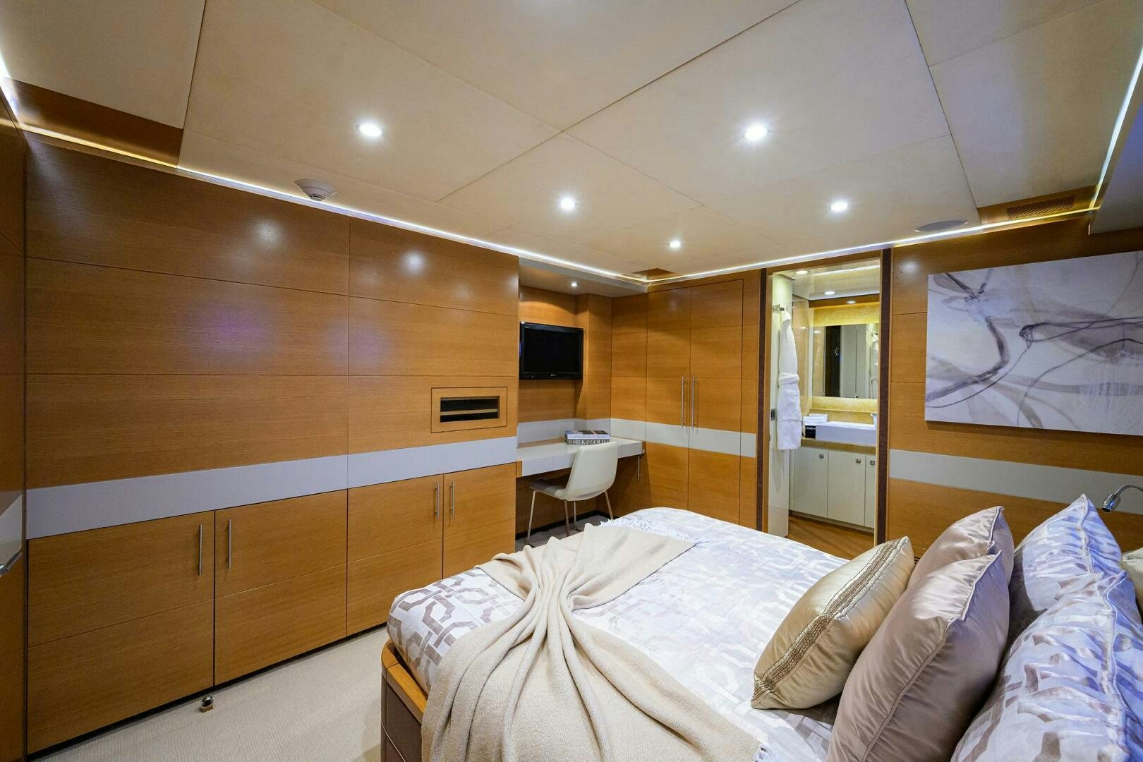 a bedroom with a bed and a television aboard KIMBERLIE Yacht for Sale