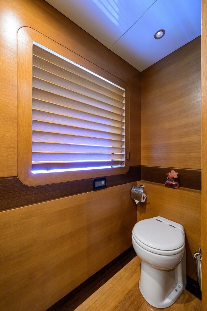 a small bathroom with a toilet aboard KIMBERLIE Yacht for Sale