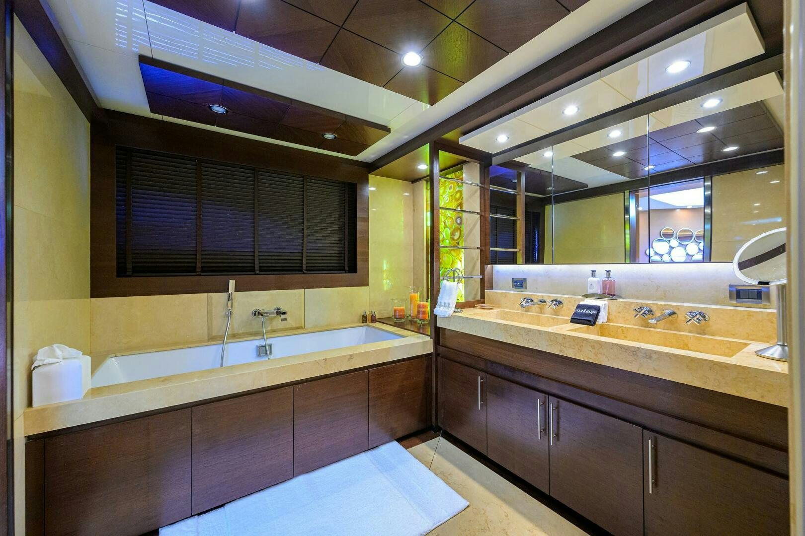 a large bathroom with a large mirror aboard KIMBERLIE Yacht for Sale
