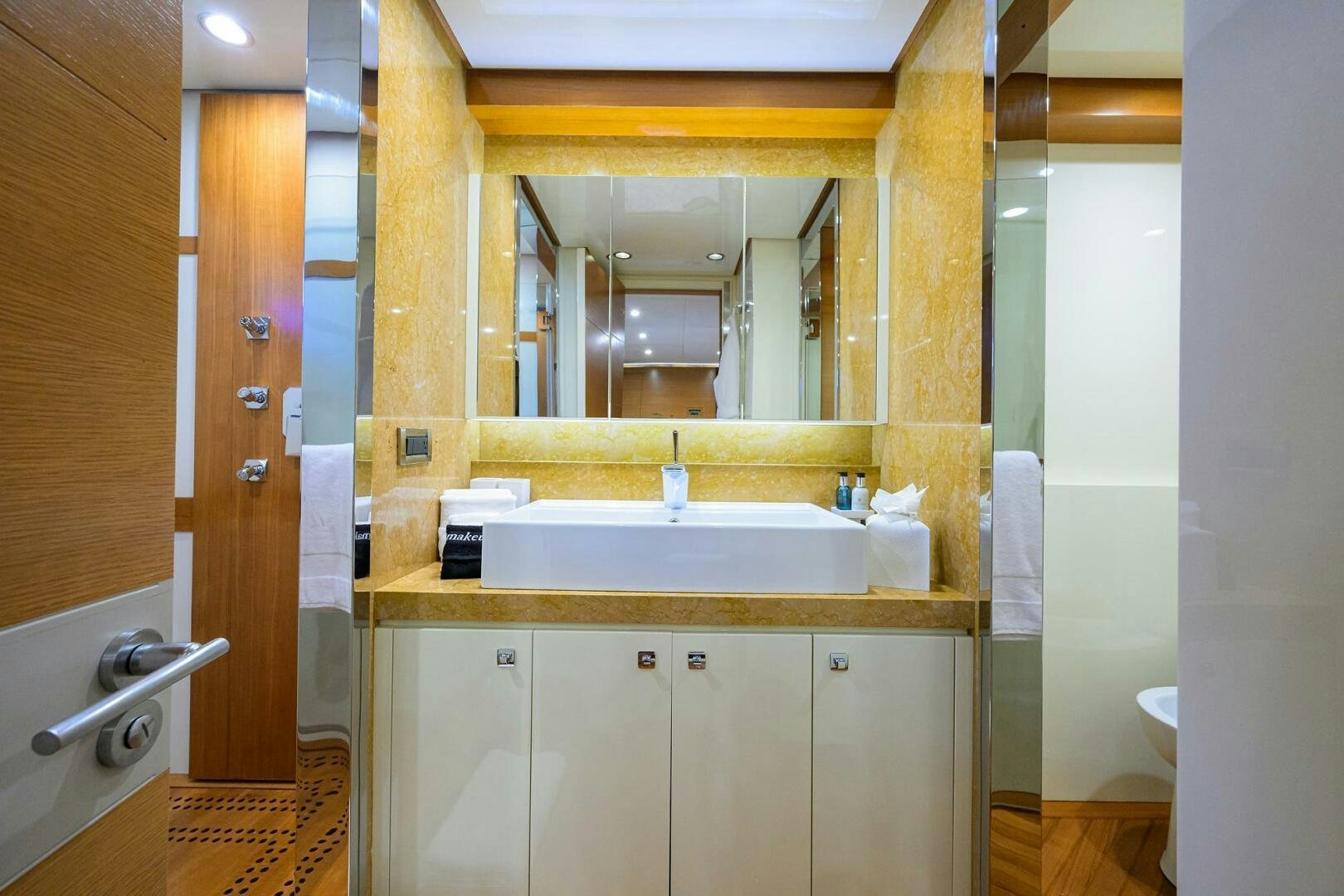 a bathroom with a large mirror aboard KIMBERLIE Yacht for Sale