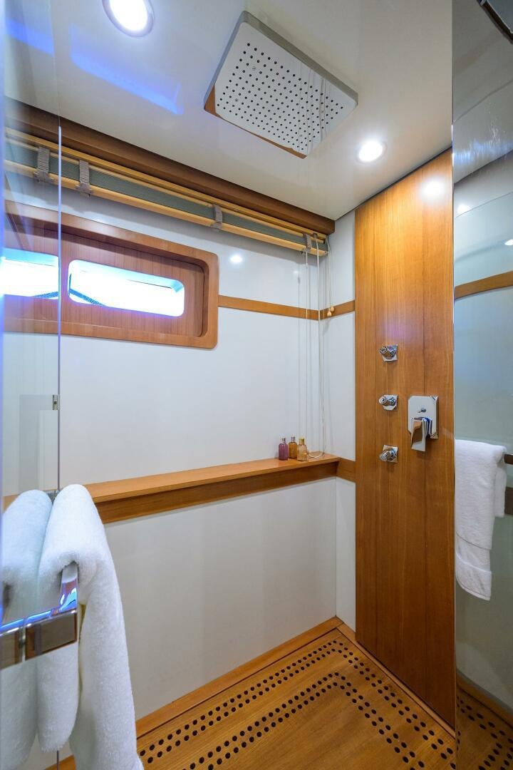 a bathroom with a mirror aboard KIMBERLIE Yacht for Sale
