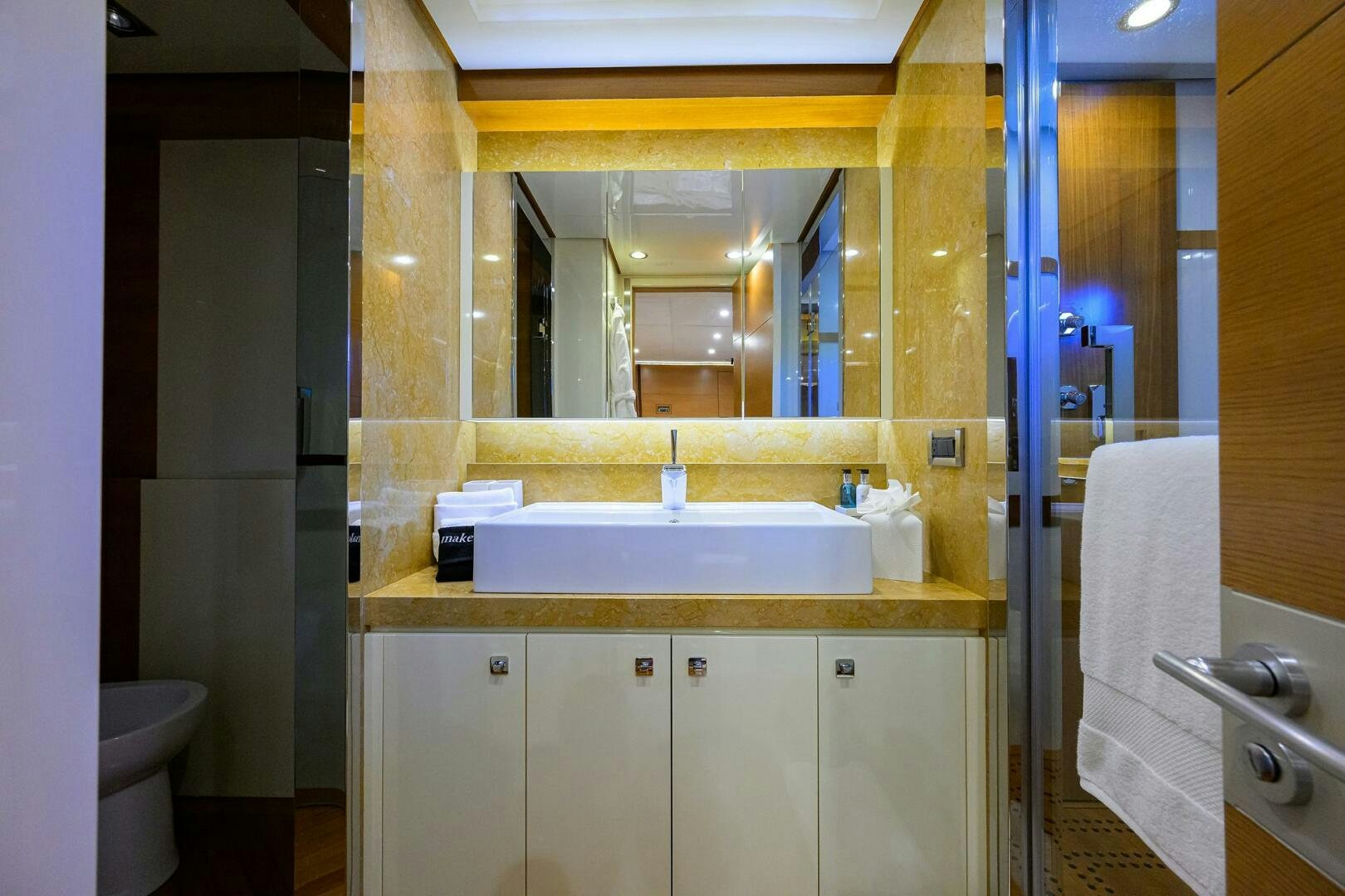 a bathroom with a sink and a mirror aboard KIMBERLIE Yacht for Sale