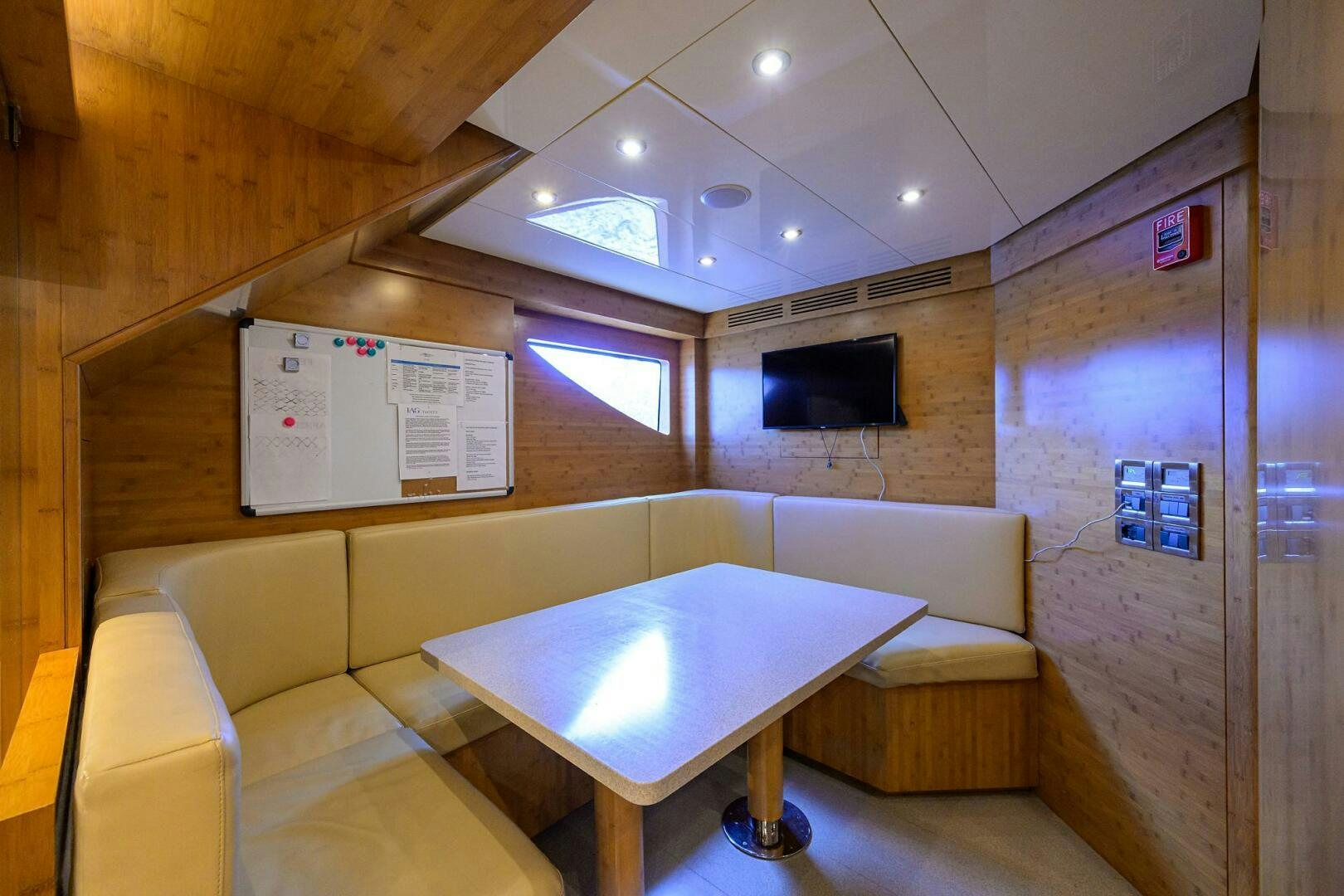 a room with a table and chairs aboard KIMBERLIE Yacht for Sale