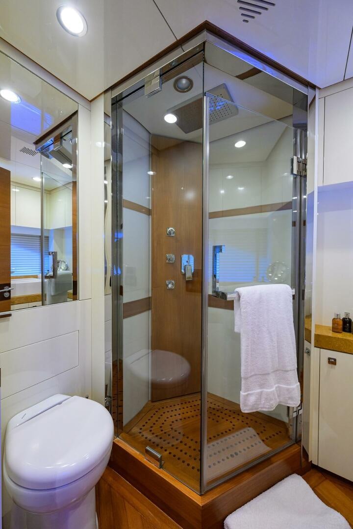 a bathroom with a glass shower aboard KIMBERLIE Yacht for Sale