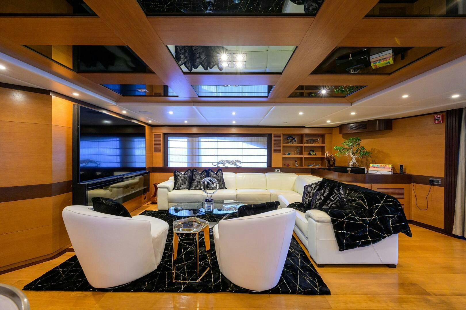 a room with a couch and a table and chairs aboard KIMBERLIE Yacht for Sale
