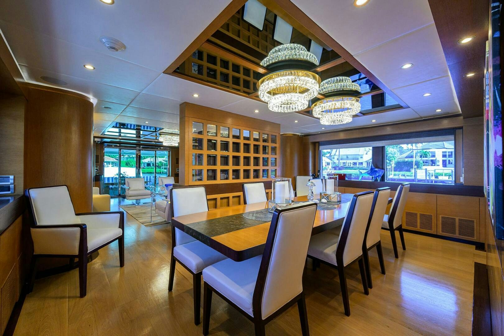 a room with tables and chairs aboard KIMBERLIE Yacht for Sale