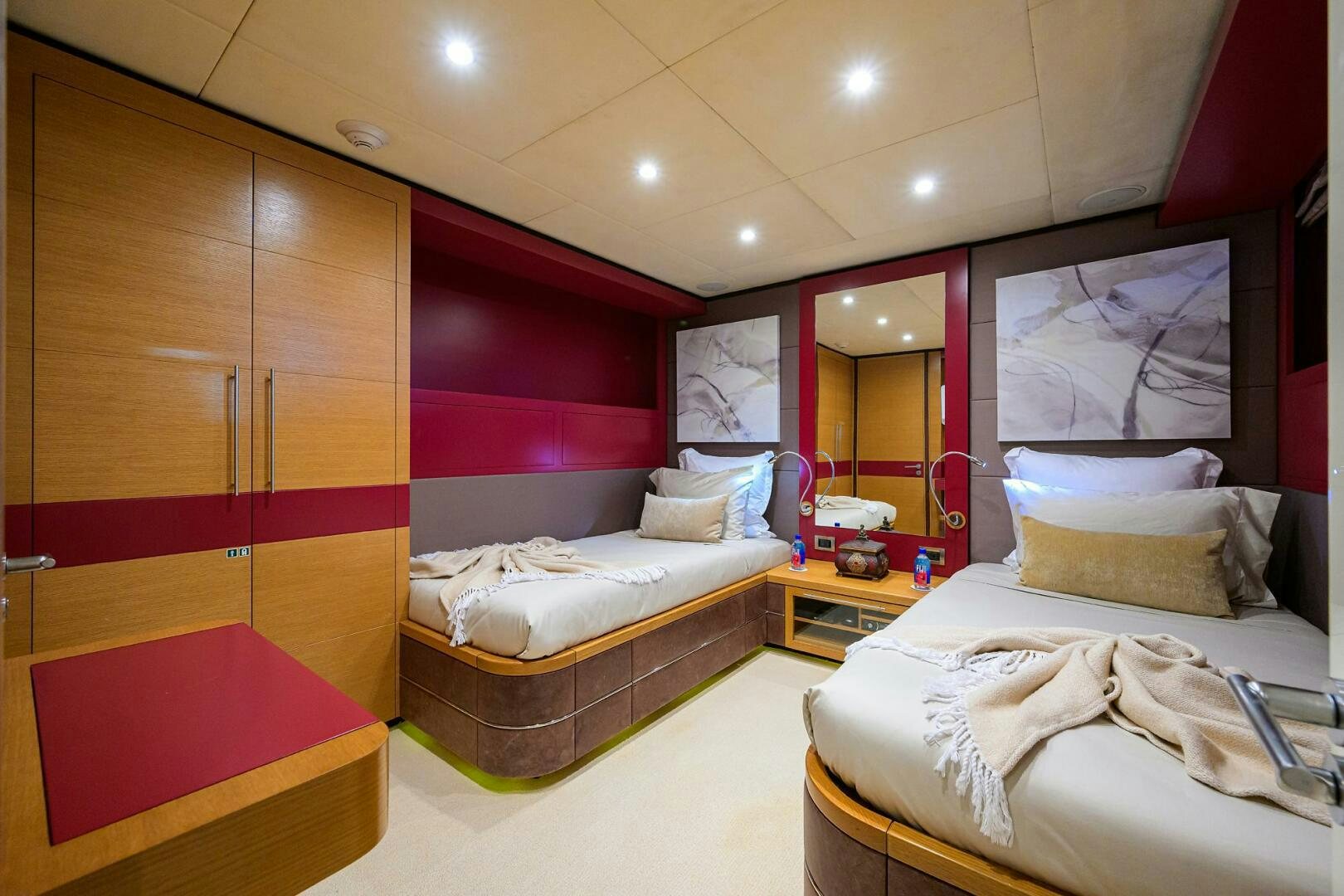 a room with a bed and a mirror aboard KIMBERLIE Yacht for Sale