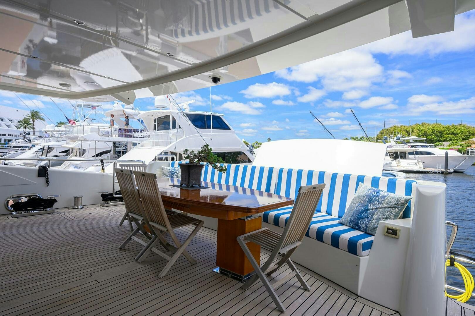 a table and chairs on a deck aboard KIMBERLIE Yacht for Sale