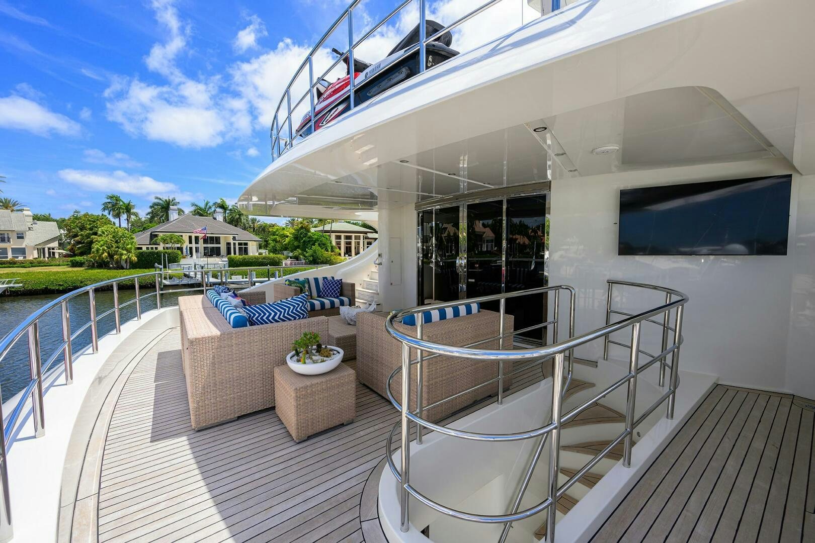 a deck with a pool and a deck with a house and trees aboard KIMBERLIE Yacht for Sale