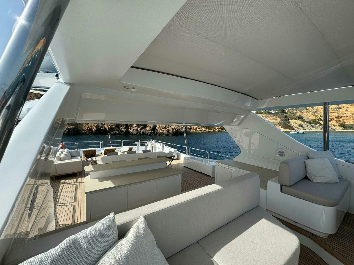 a large white boat with a large window and a view of the water aboard SERENDIPITY Yacht for Sale