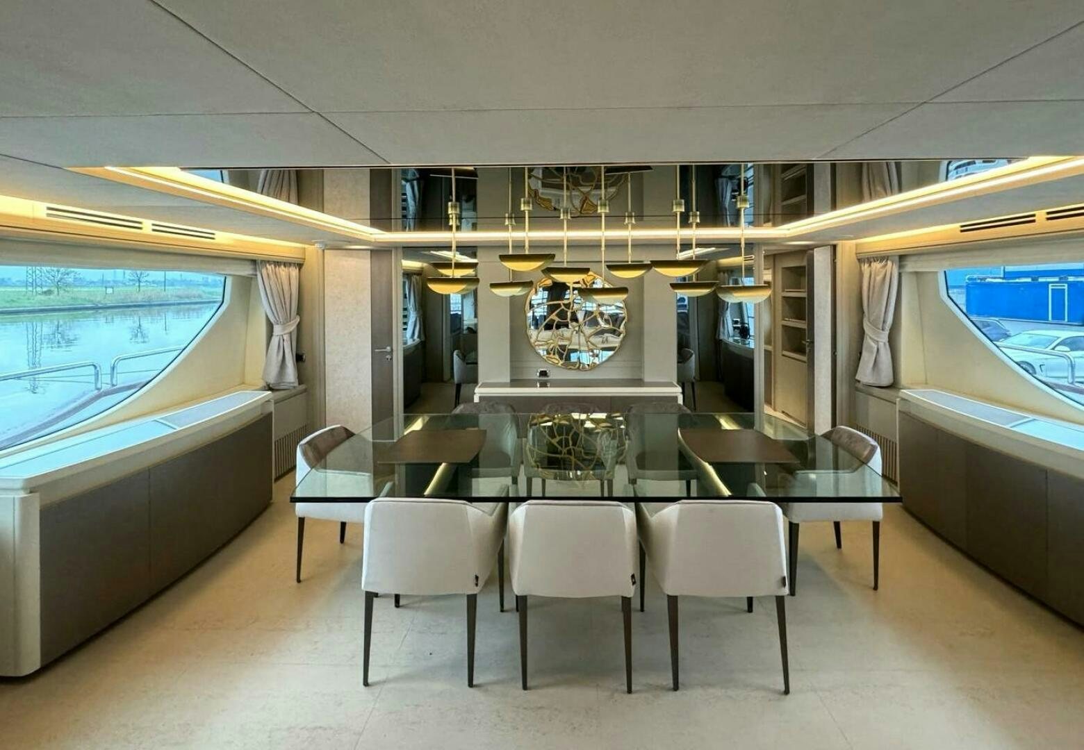 a room with tables and chairs aboard SERENDIPITY Yacht for Sale