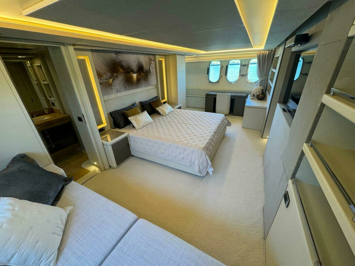 a room with a bed and a mirror aboard SERENDIPITY Yacht for Sale
