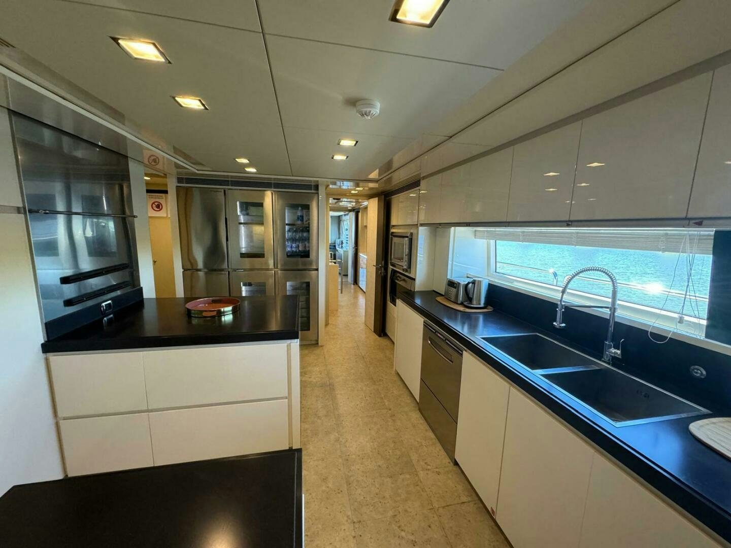 a kitchen with a large island aboard SERENDIPITY Yacht for Sale