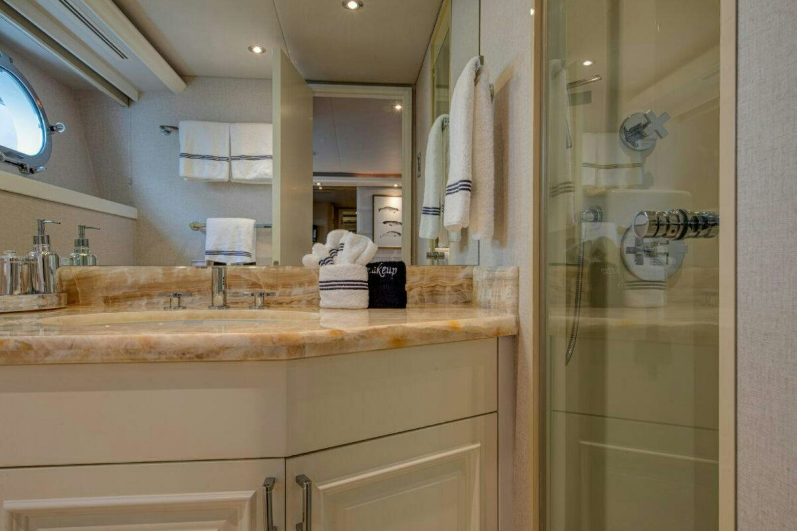 a bathroom with a large mirror aboard BOXER Yacht for Sale