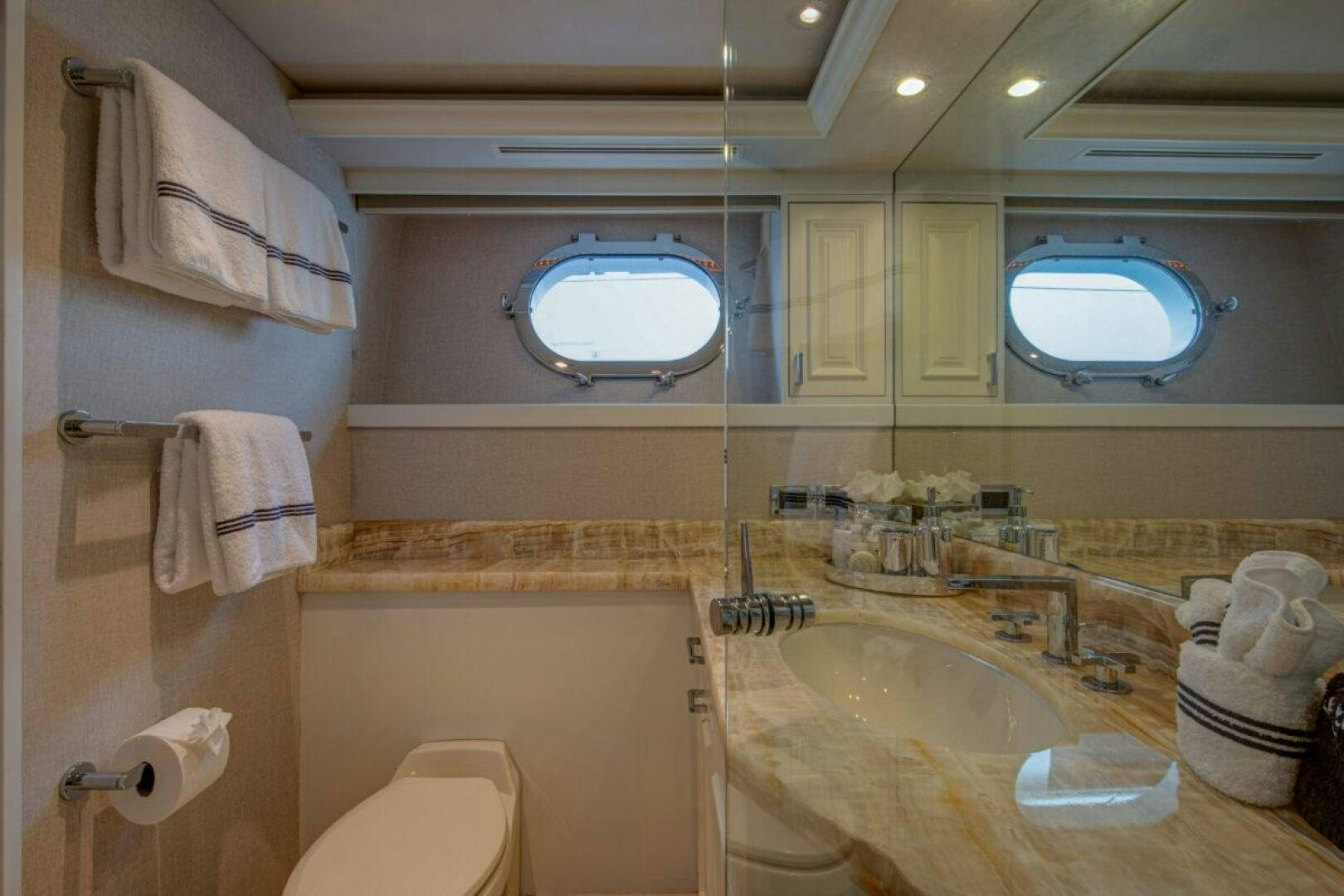 a bathroom with a large mirror aboard BOXER Yacht for Sale