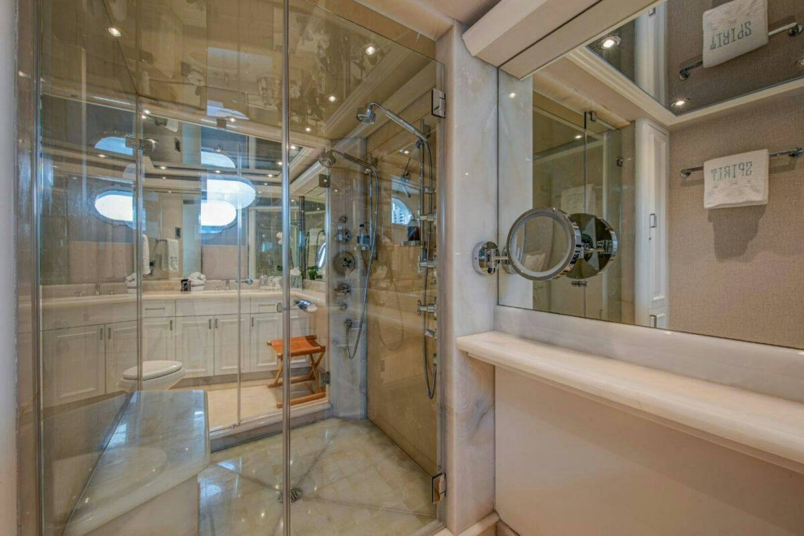 a bathroom with a glass shower aboard BOXER Yacht for Sale