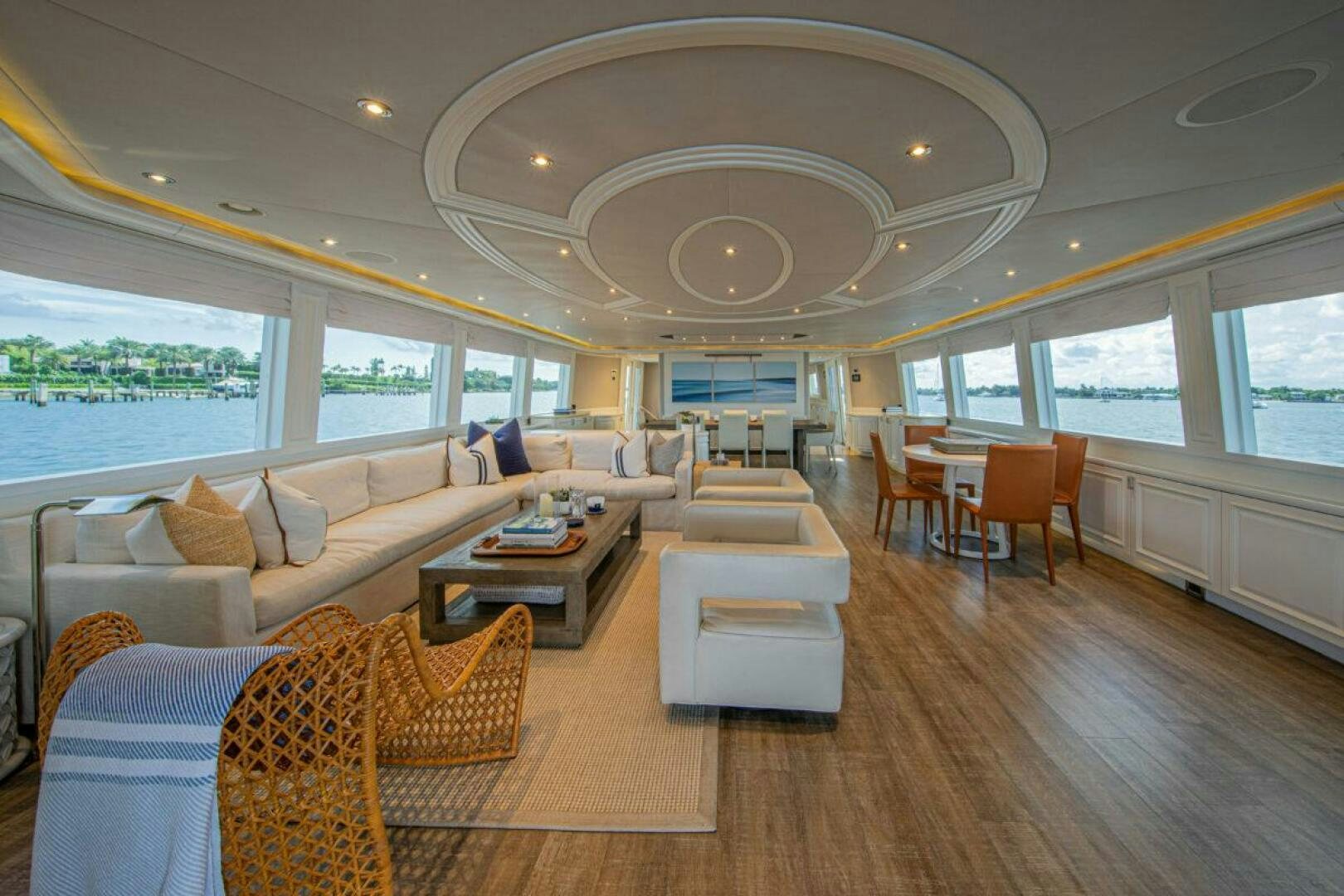 a living room with a large chandelier aboard BOXER Yacht for Sale