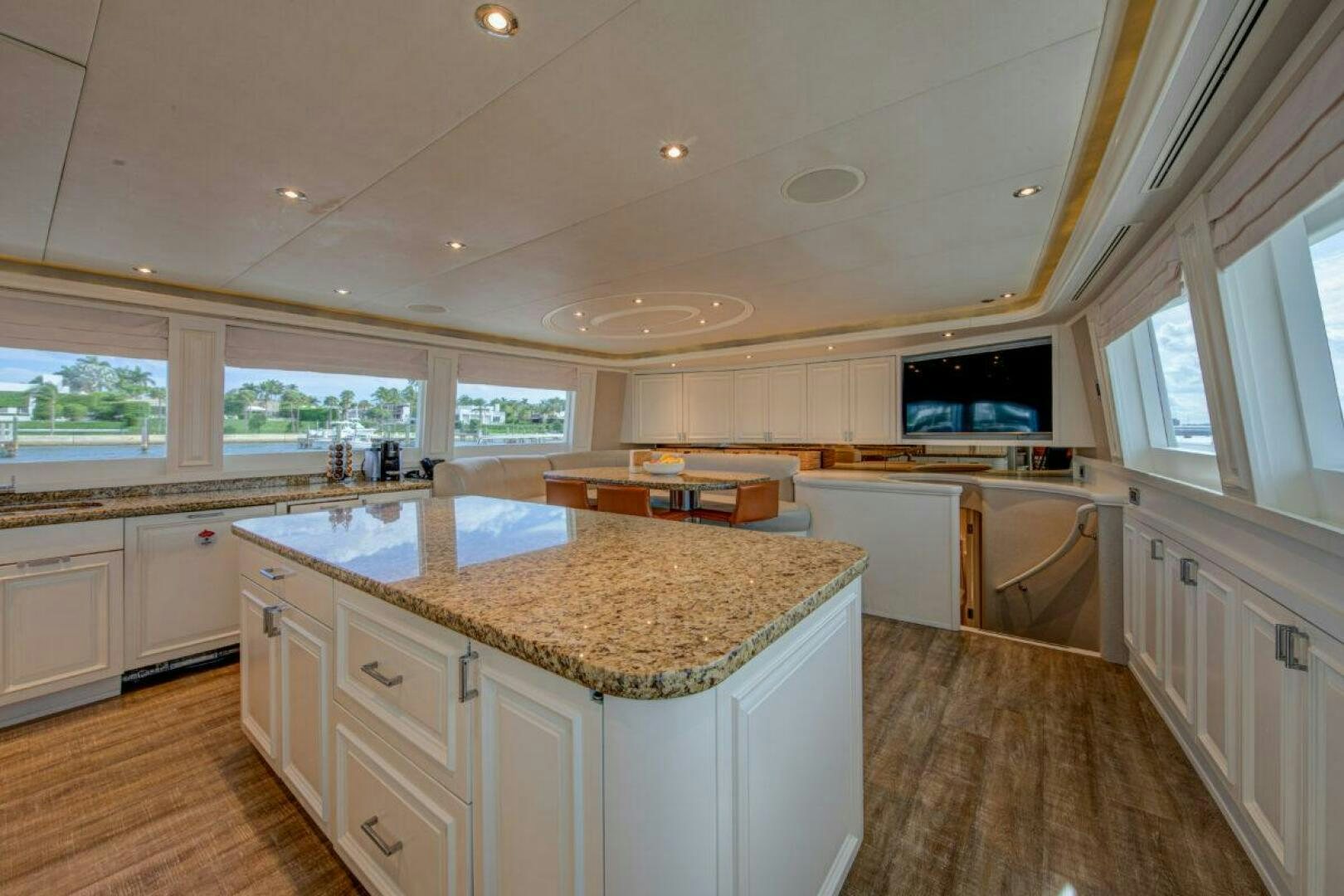 a kitchen with white cabinets aboard BOXER Yacht for Sale