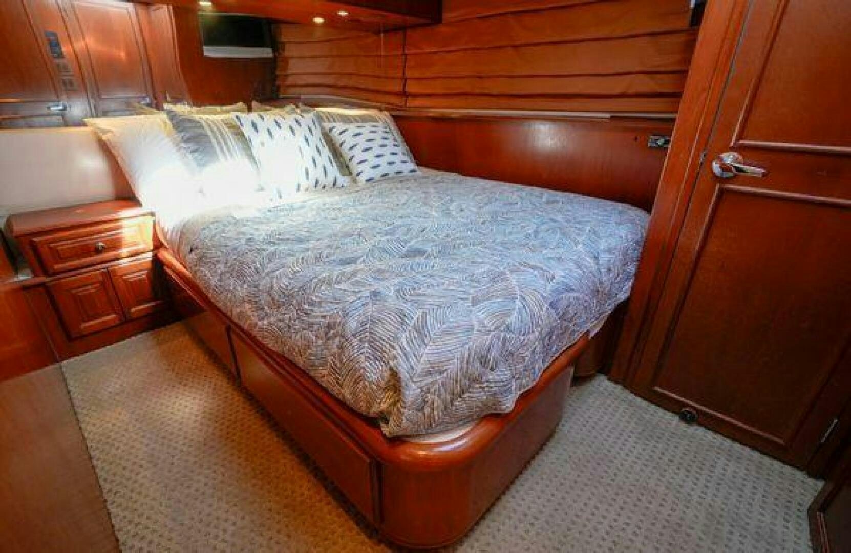 a bed in a room aboard POLE POSITION Yacht for Sale