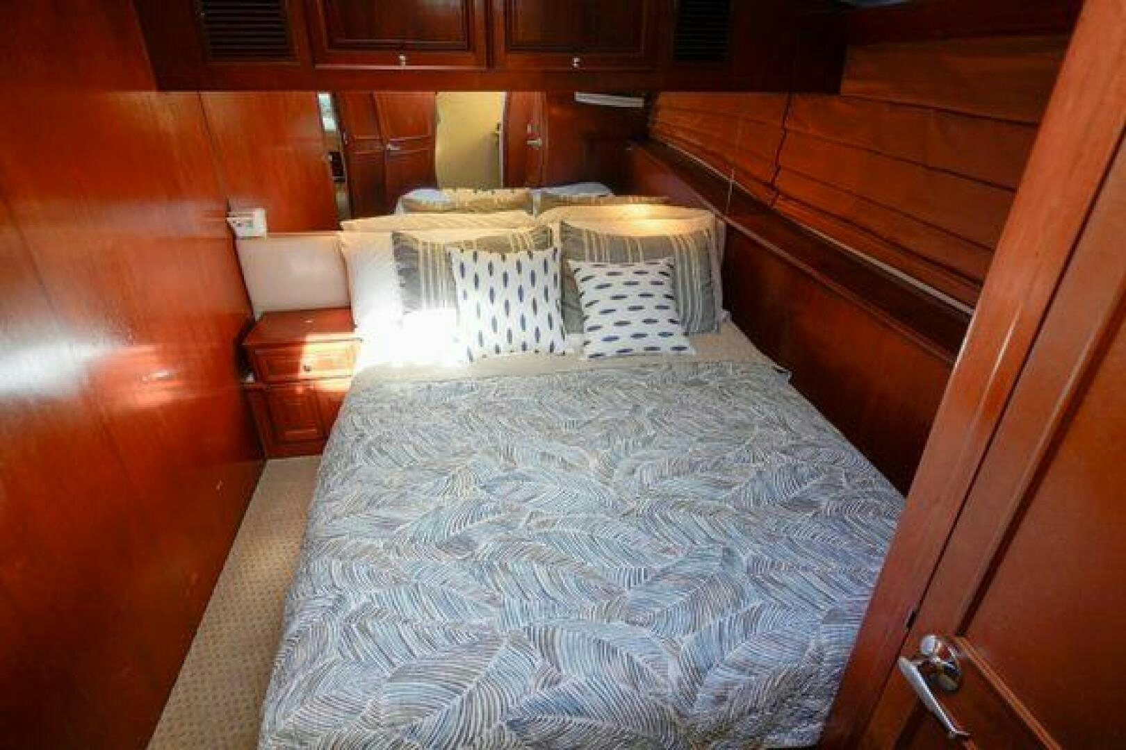 a bed with white sheets aboard POLE POSITION Yacht for Sale