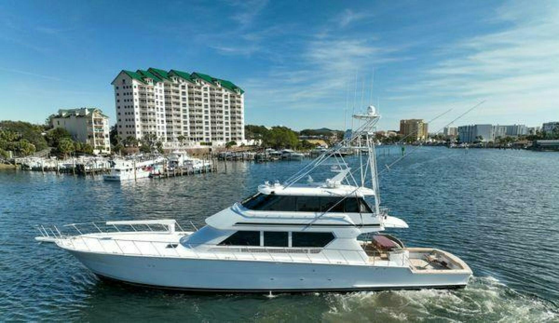 a white yacht in the water aboard POLE POSITION Yacht for Sale