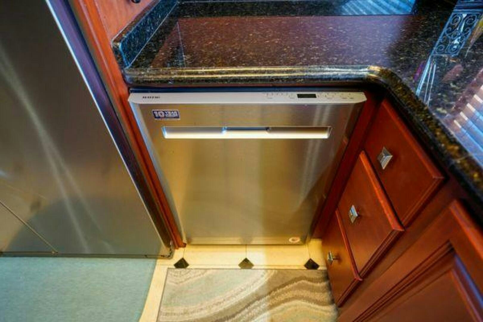 a kitchen with a stainless steel oven aboard POLE POSITION Yacht for Sale