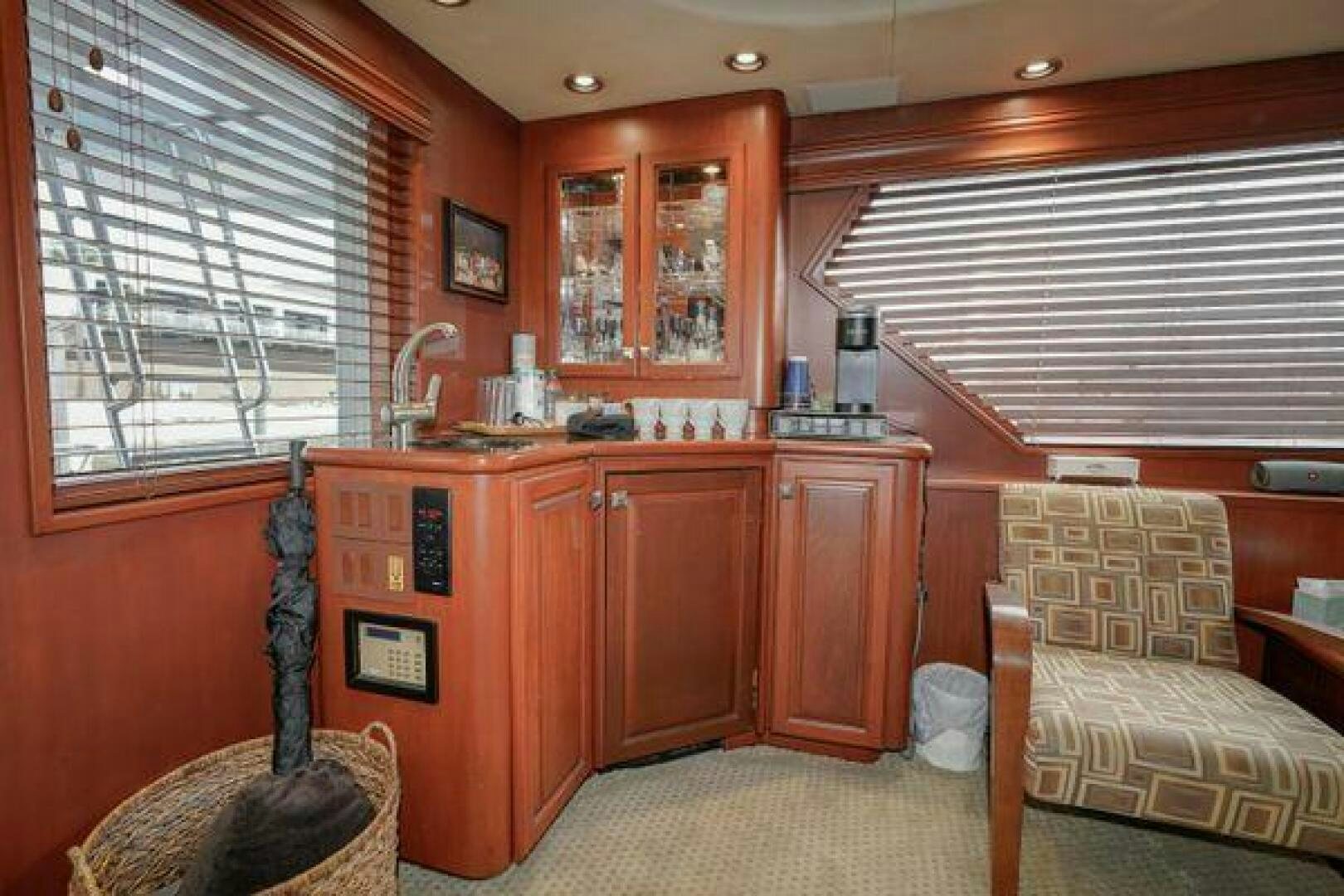 a living room with a couch and a chair aboard POLE POSITION Yacht for Sale